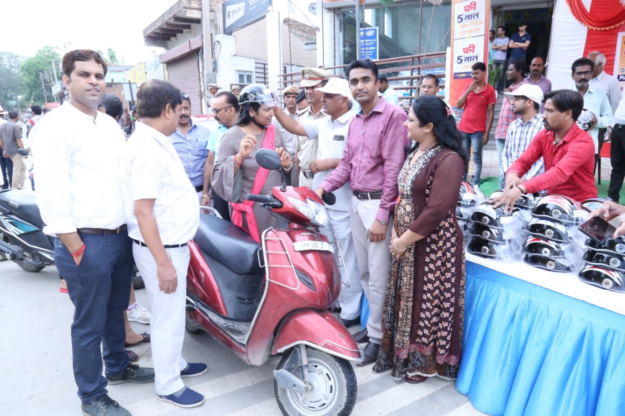 Road Safety Awareness & Helmet Distribution Camp for Ladies.