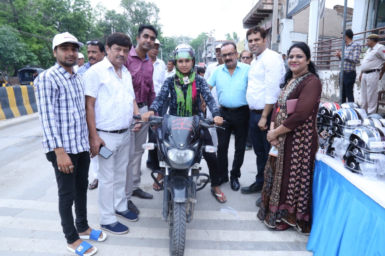 Road Safety Awareness & Helmet Distribution Camp for Ladies.