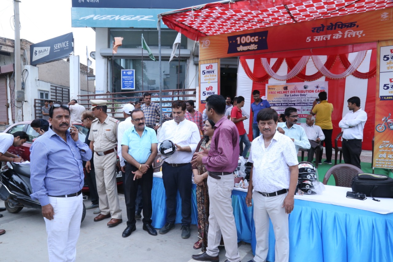 Road Safety Awareness & Helmet Distribution Camp for Ladies.