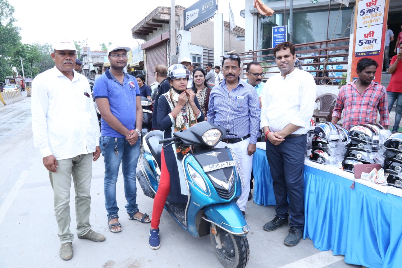 Road Safety Awareness & Helmet Distribution Camp for Ladies.