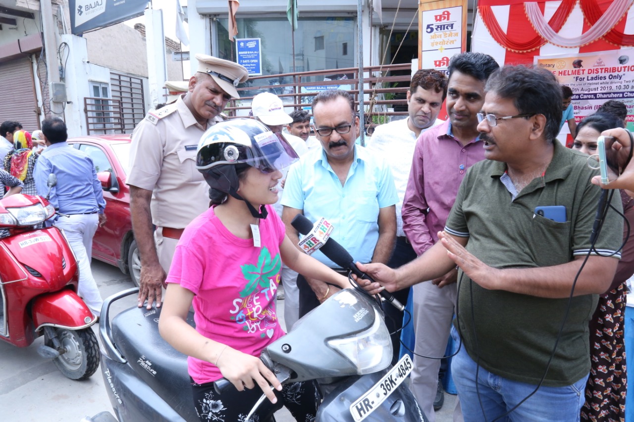 Road Safety Awareness & Helmet Distribution Camp for Ladies.