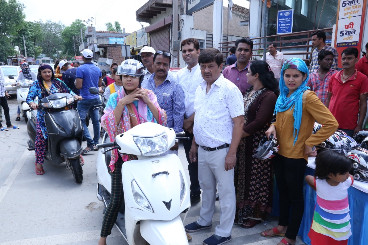 Road Safety Awareness & Helmet Distribution Camp for Ladies.