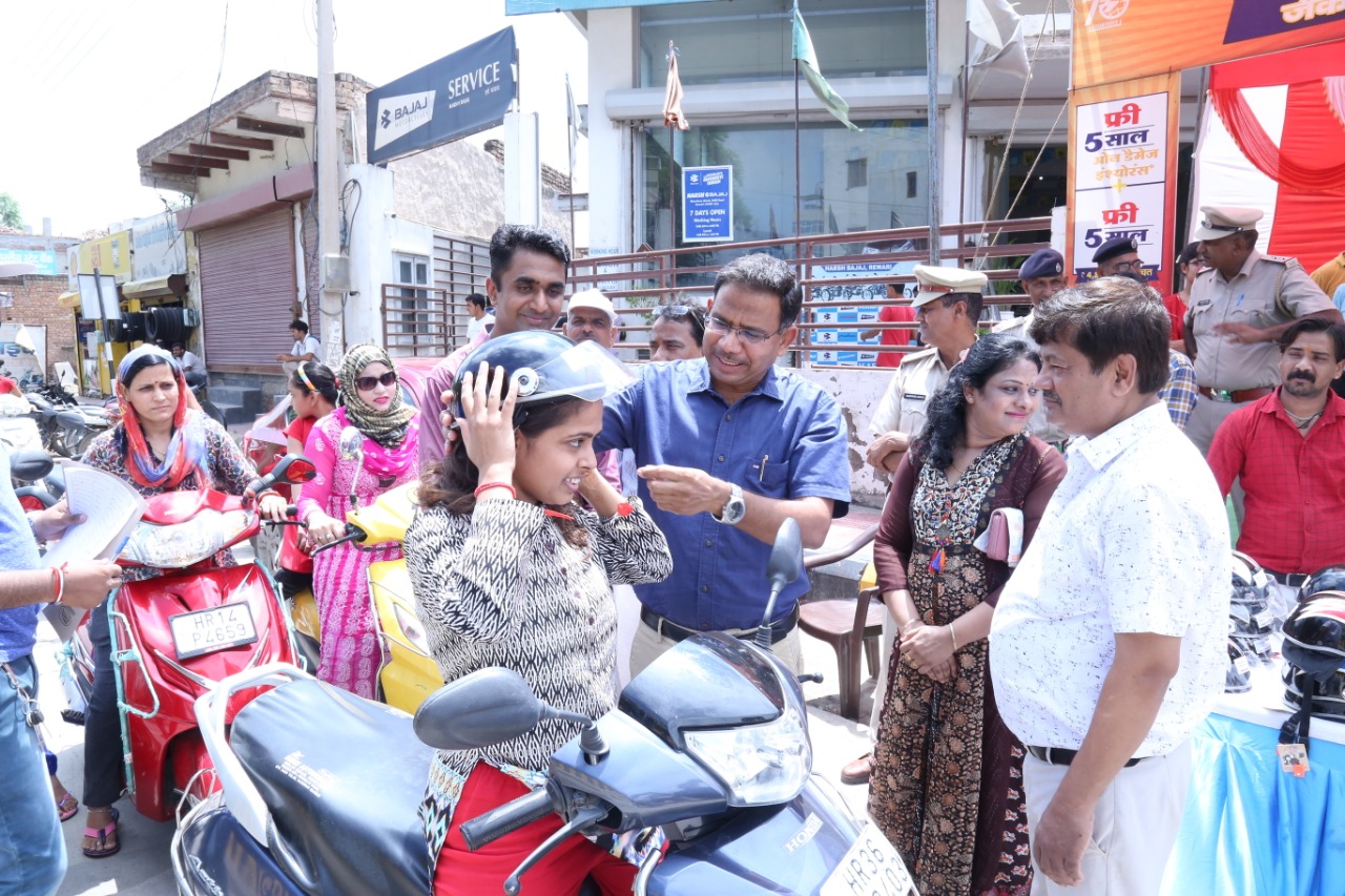 Road Safety Awareness & Helmet Distribution Camp for Ladies.