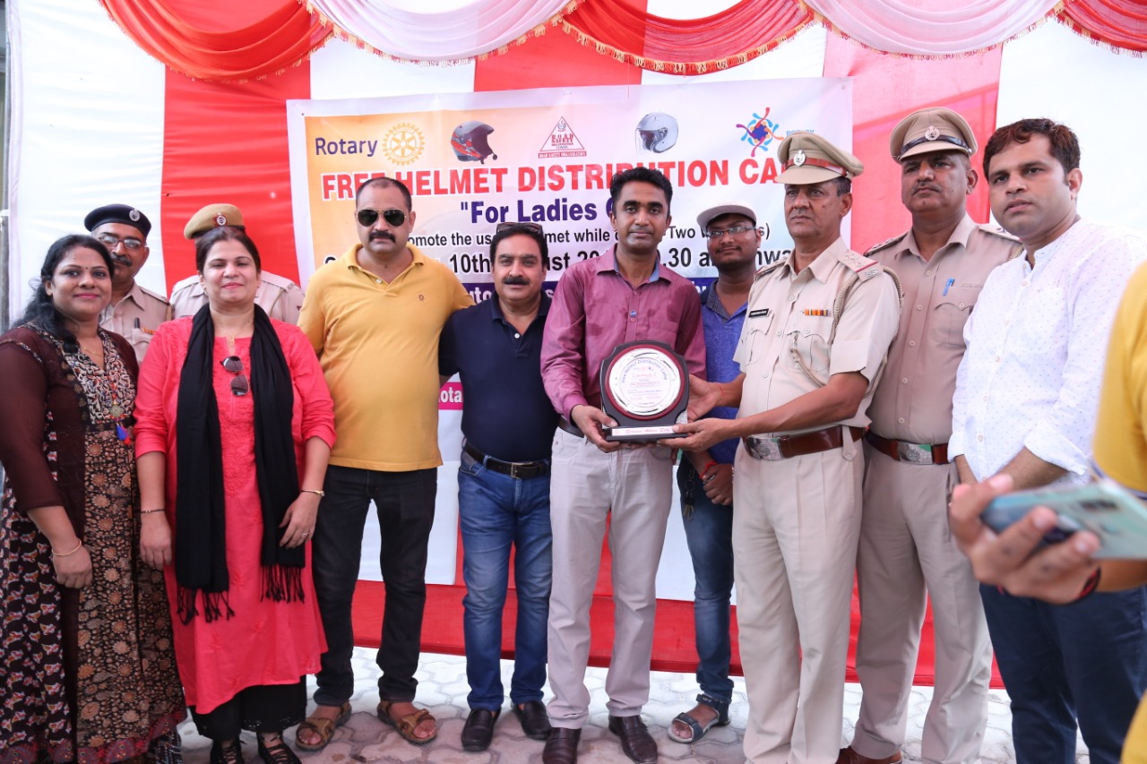 Road Safety Awareness & Helmet Distribution Camp for Ladies.