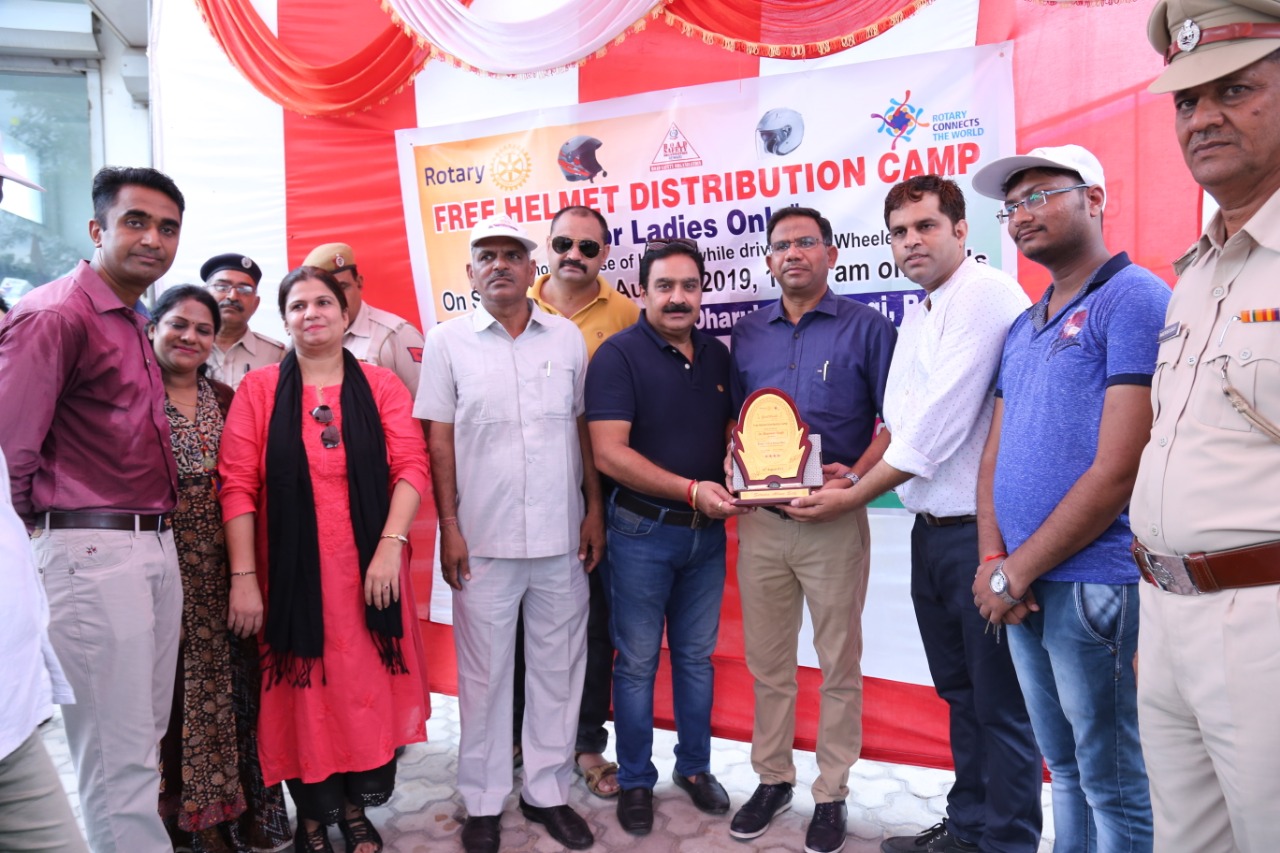 Road Safety Awareness & Helmet Distribution Camp for Ladies.