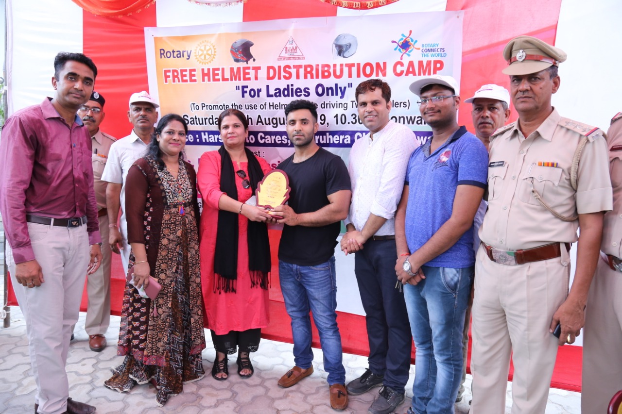 Road Safety Awareness & Helmet Distribution Camp for Ladies.