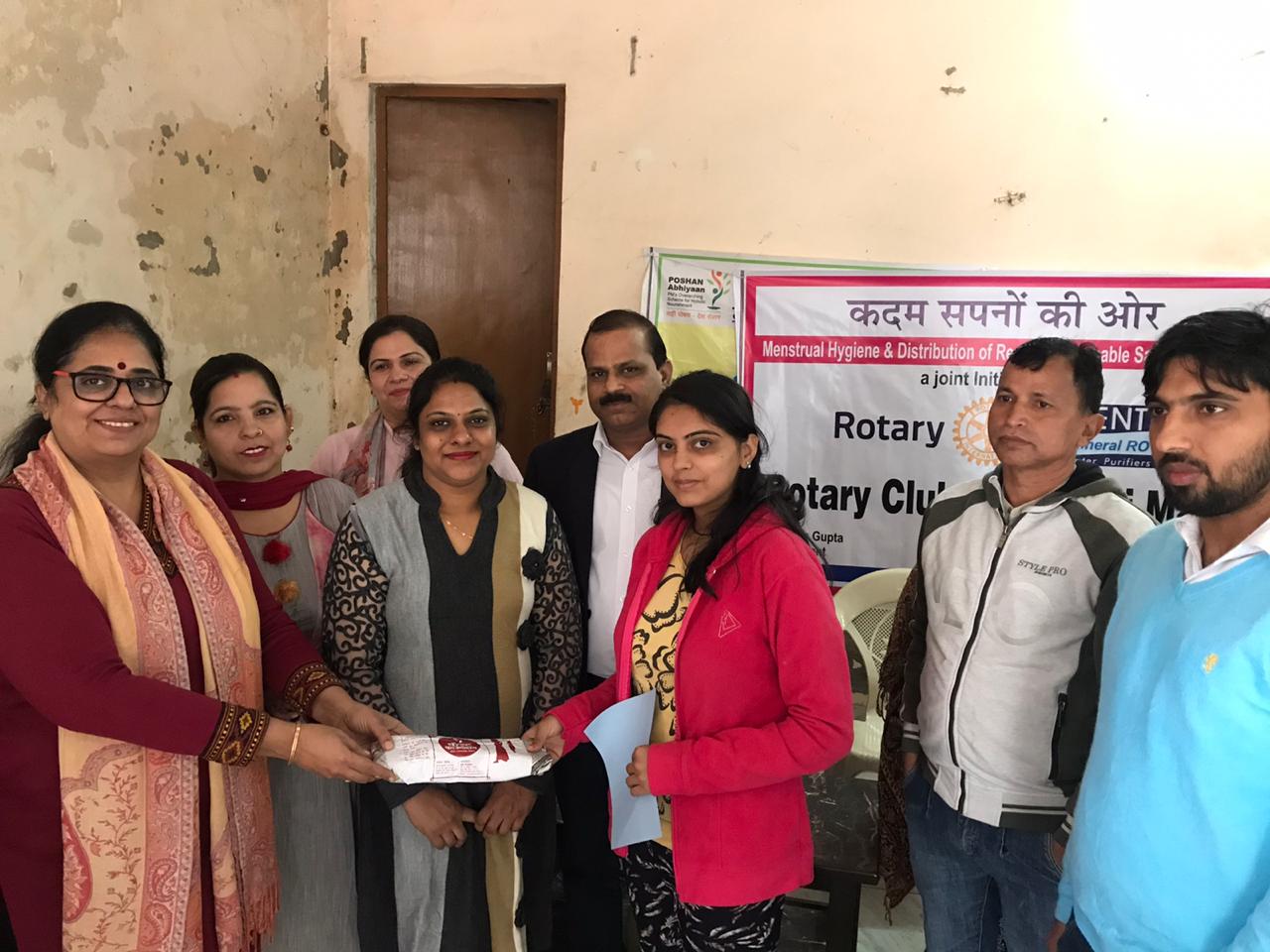 SANITARY PADS DISTRIBUTION TO LADIES DURING HEALTH CAMP