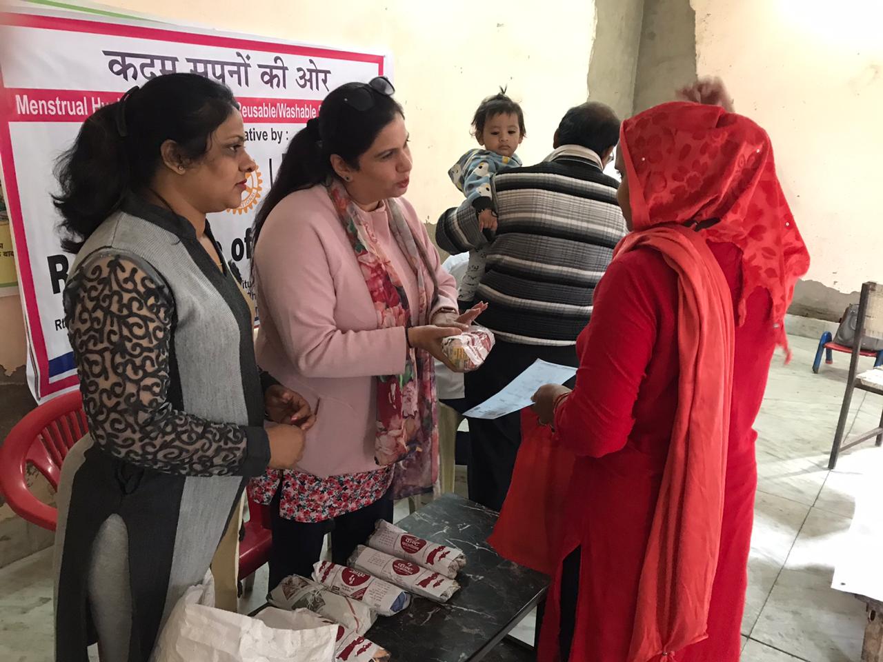 SANITARY PADS DISTRIBUTION TO LADIES DURING HEALTH CAMP