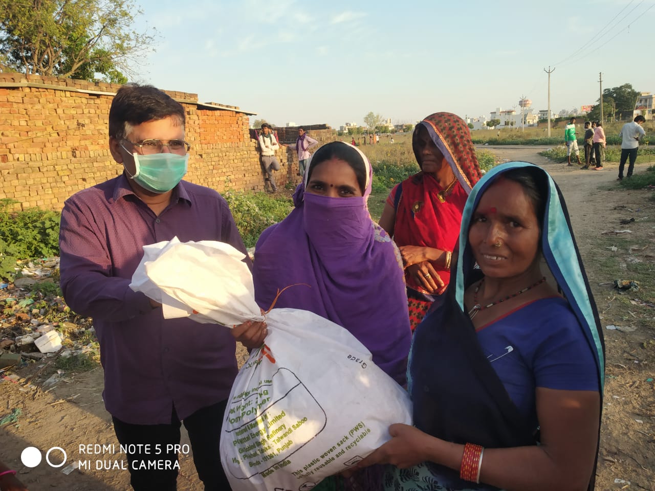 DISTRIBUTION OF FOOD KITS TO LESS PREVILEDGD FAMILIES OF REWARI