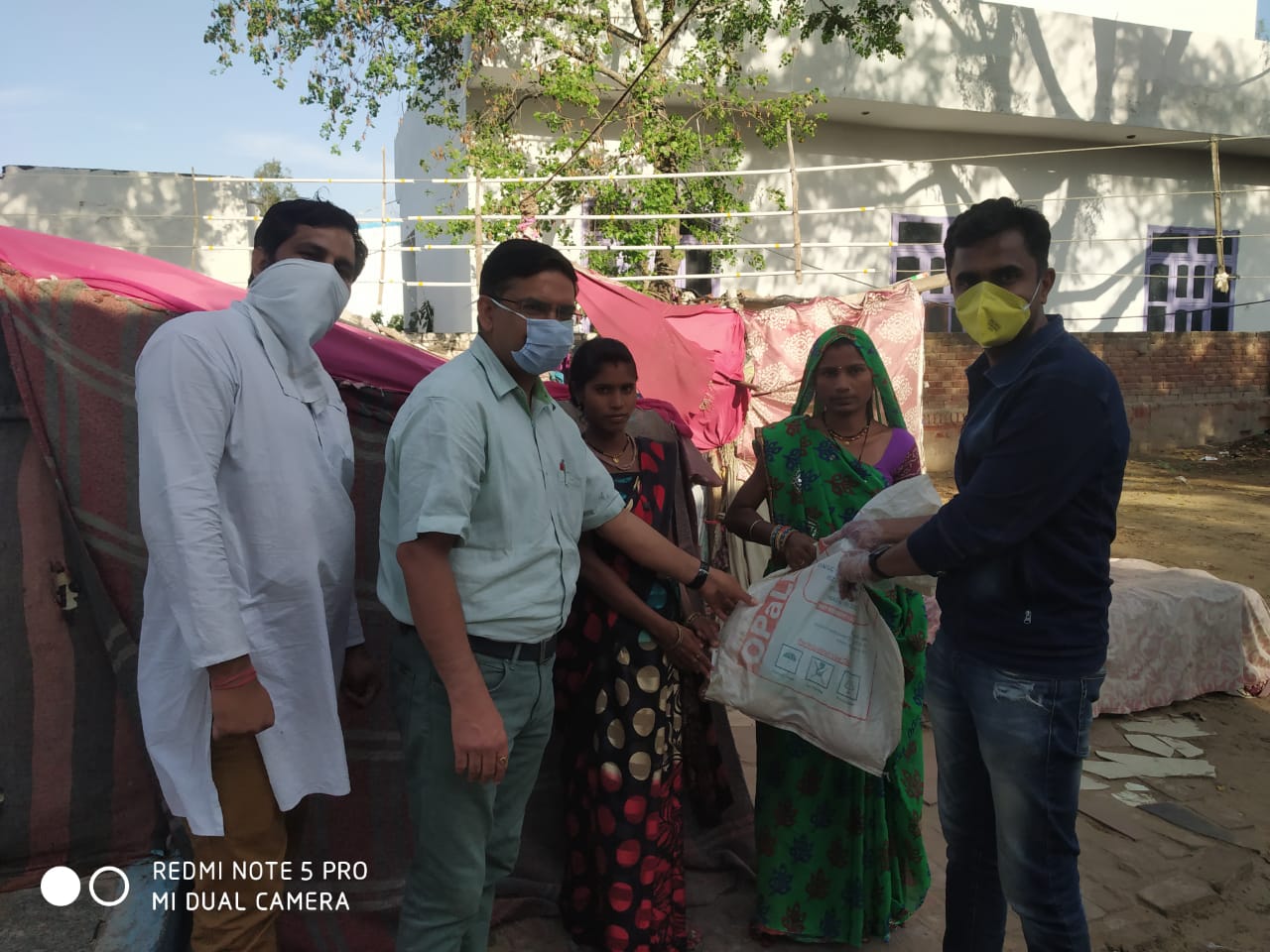 DISTRIBUTION OF FOOD KITS TO LESS PREVILEDGD FAMILIES OF REWARI