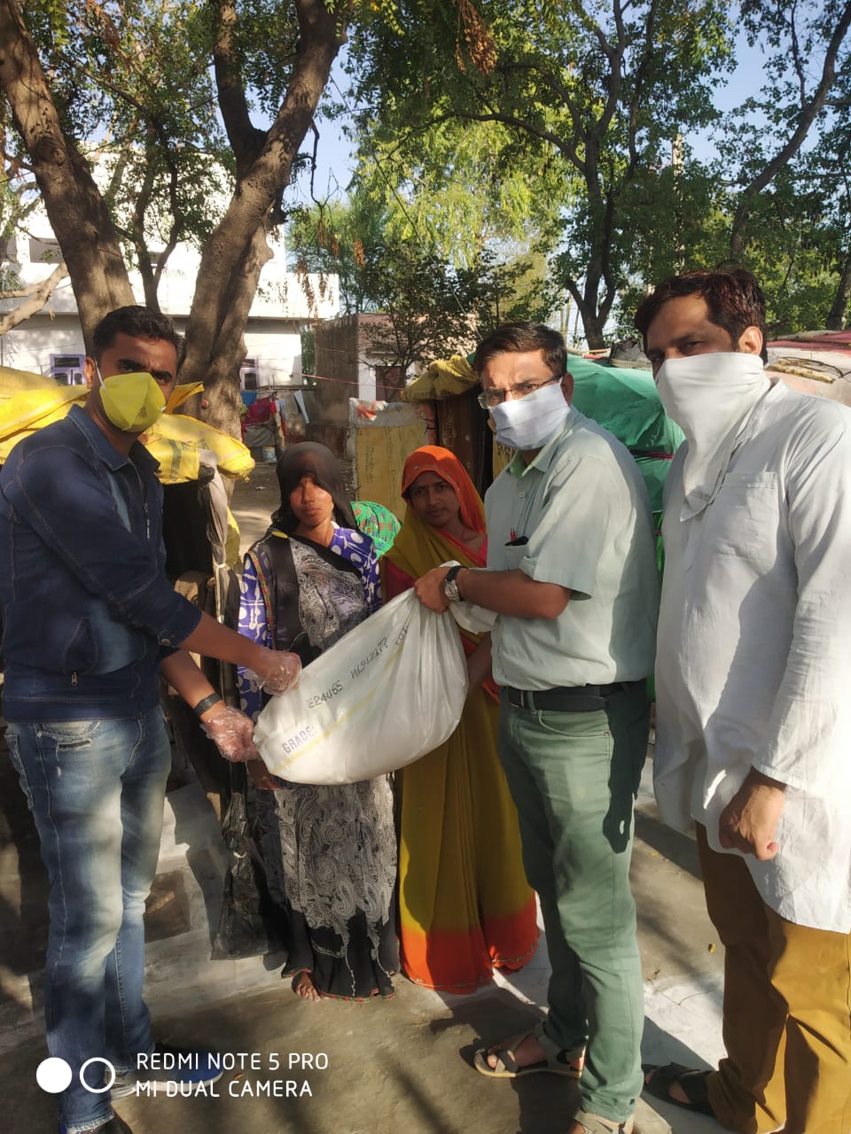 DISTRIBUTION OF FOOD KITS TO LESS PREVILEDGD FAMILIES OF REWARI