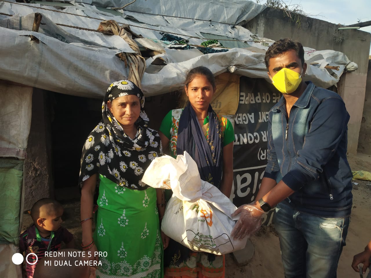 DISTRIBUTION OF FOOD KITS TO LESS PREVILEDGD FAMILIES OF REWARI