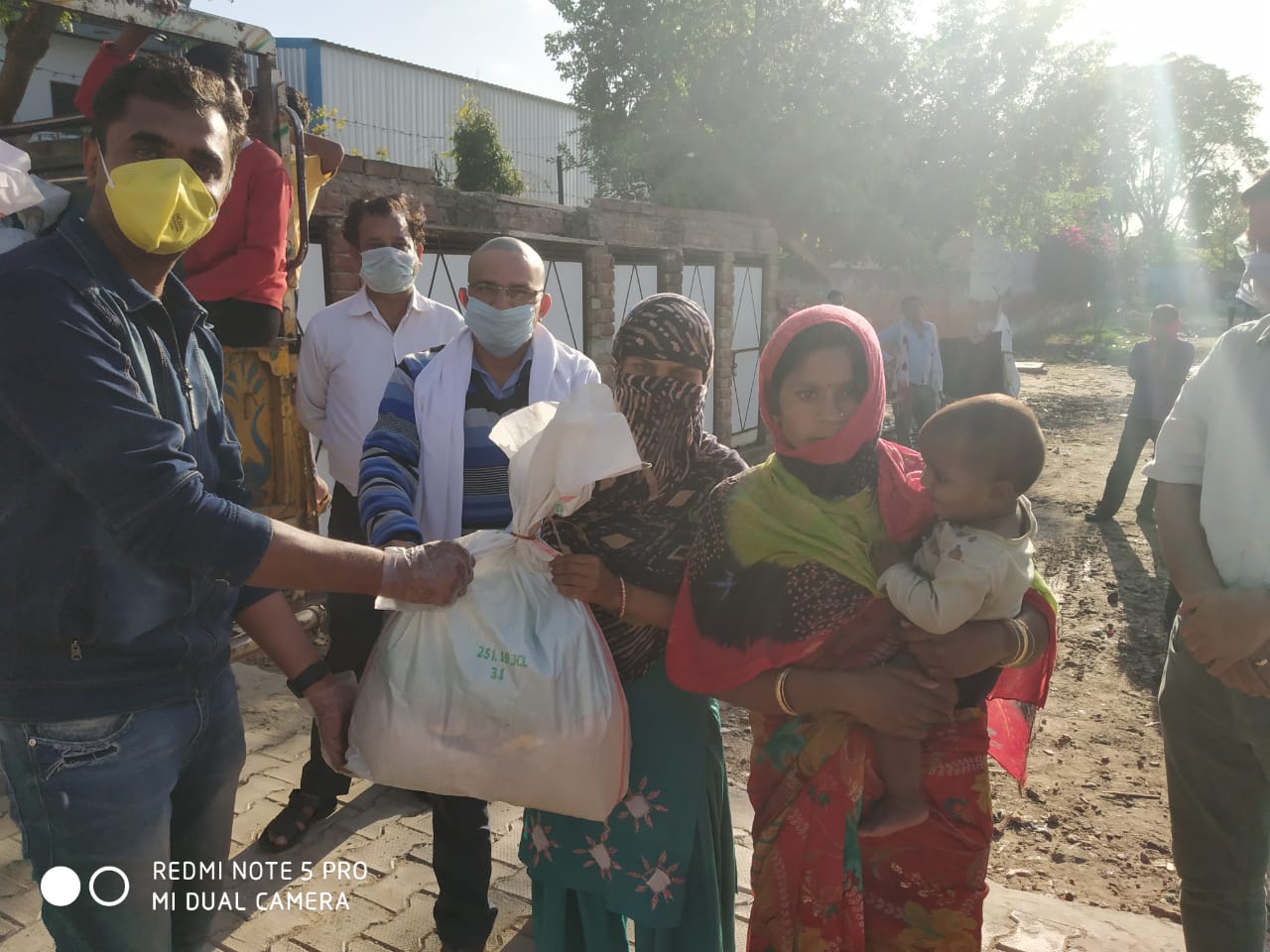 DISTRIBUTION OF FOOD KITS TO LESS PREVILEDGD FAMILIES OF REWARI