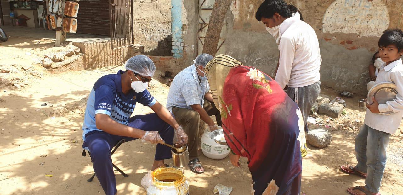 DISTRIBUTION OF FOOD TO LESS PREVILEDGD FAMILIES OF REWARI