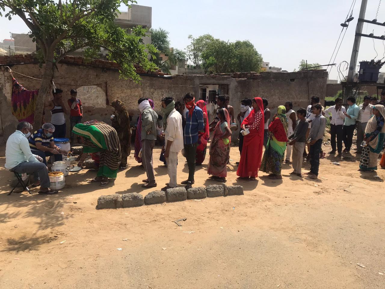 DISTRIBUTION OF FOOD TO LESS PREVILEDGD FAMILIES OF REWARI