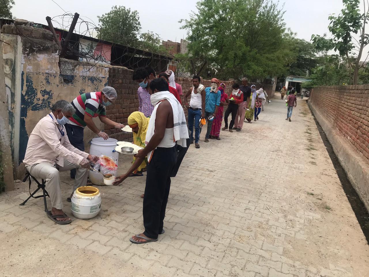 DISTRIBUTION OF FOOD TO LESS PREVILEDGD FAMILIES OF REWARI