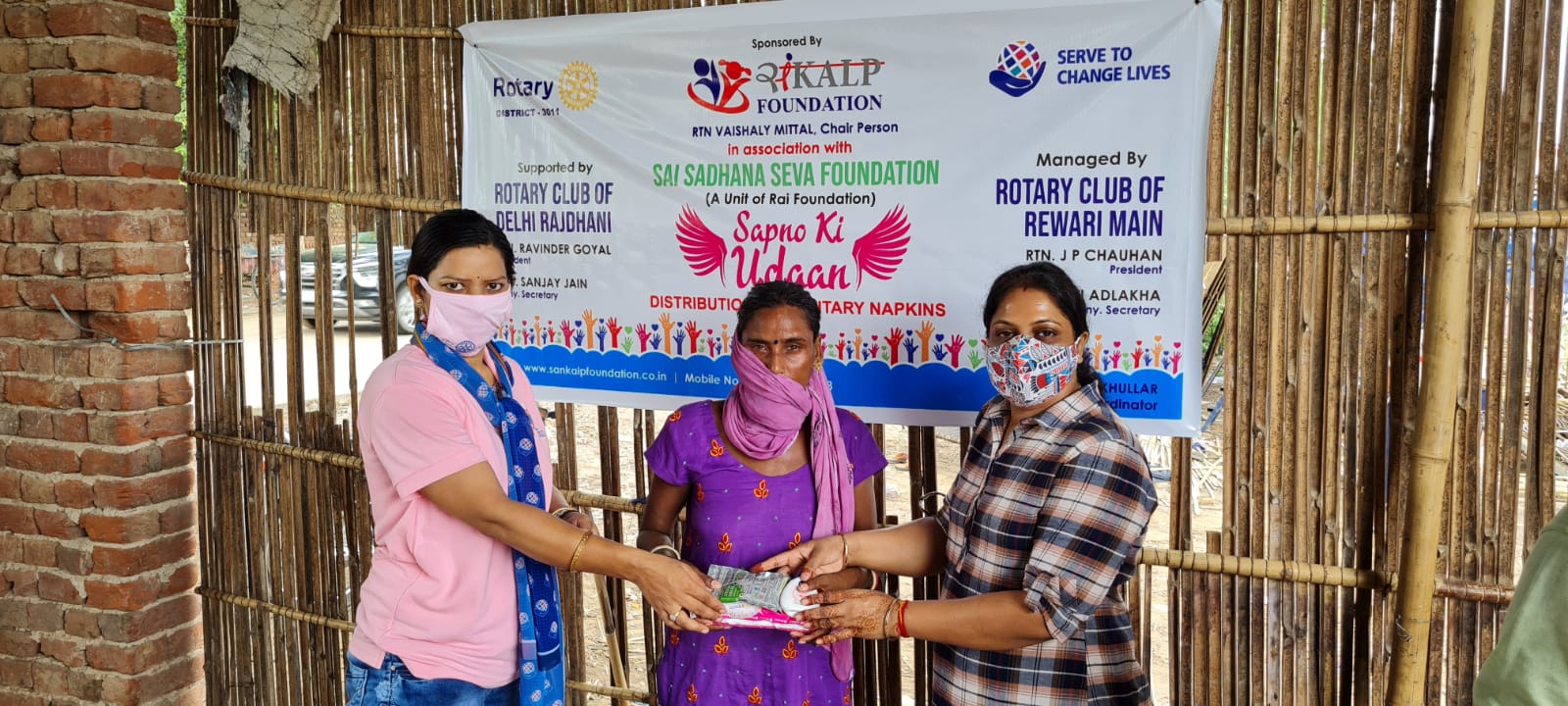 Distribution of Sanitary Napkins , Face wash & Coronil kit