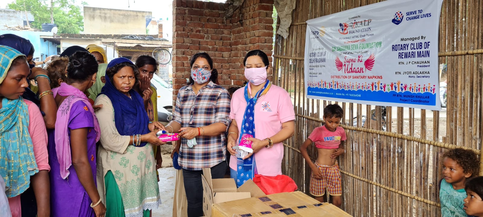 Distribution of Sanitary Napkins , Face wash & Coronil kit