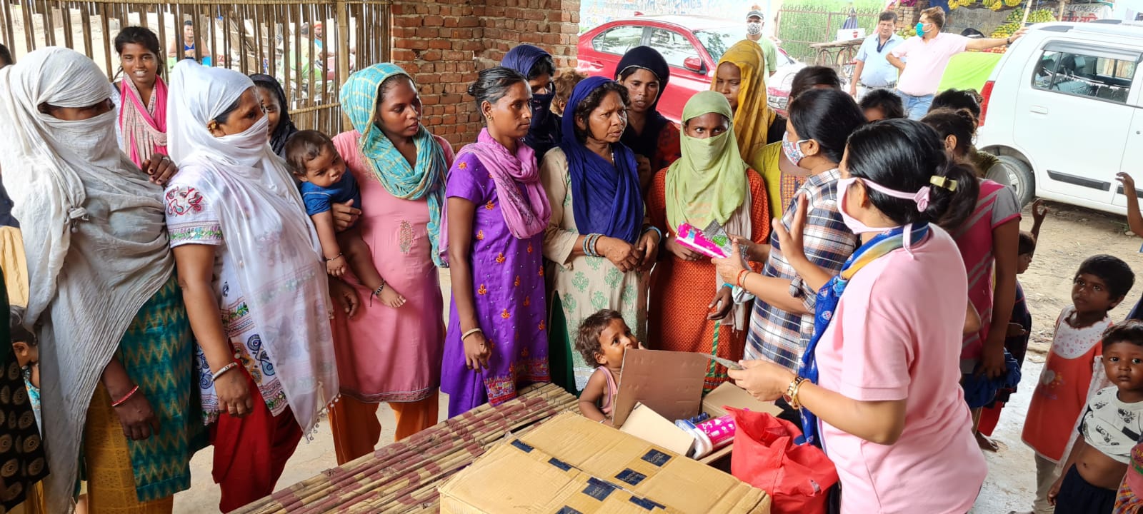 Distribution of Sanitary Napkins , Face wash & Coronil kit